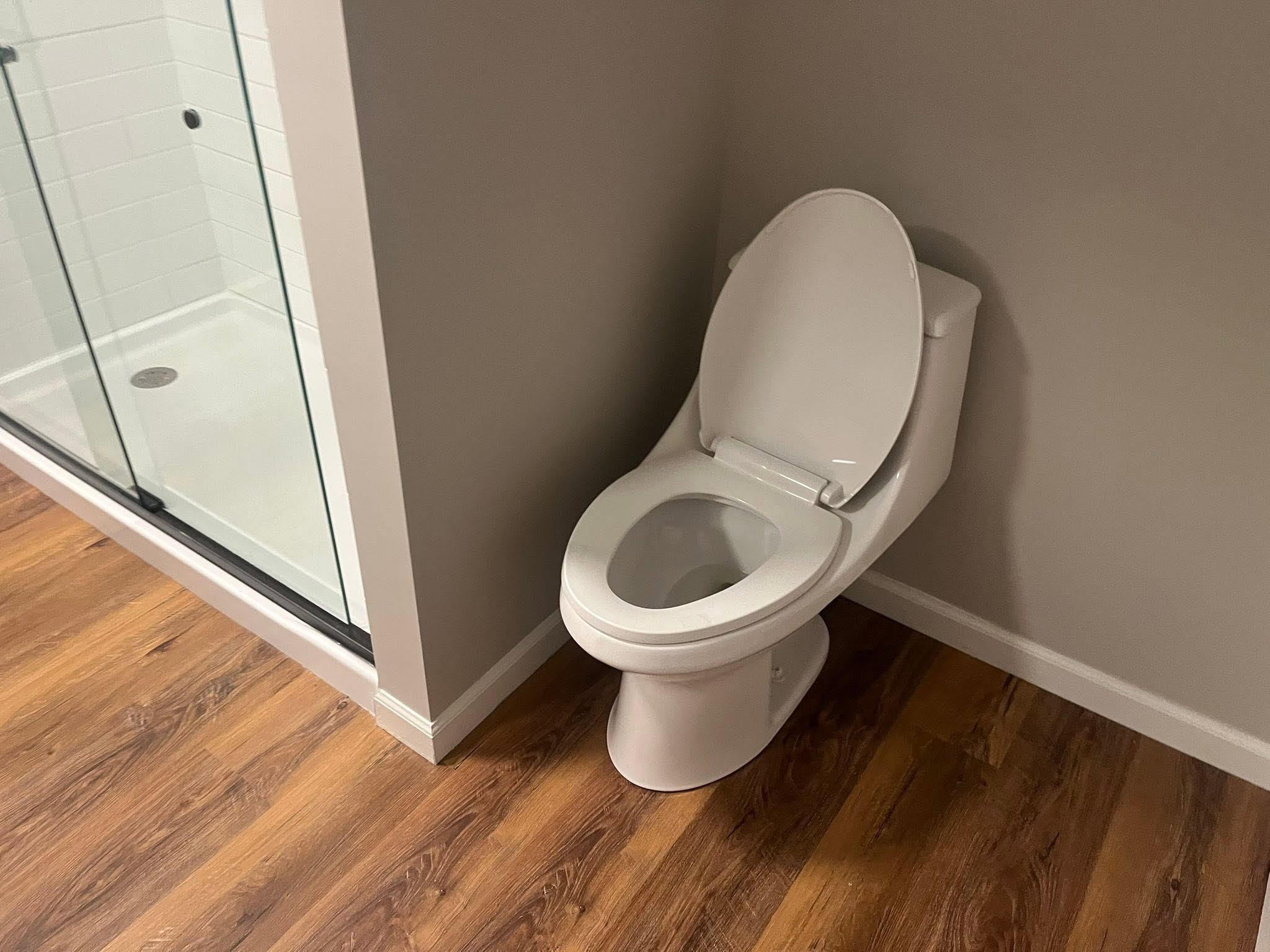 Clean bathroom toilet and shower area